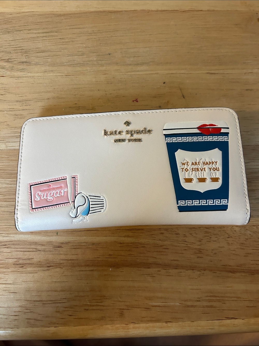 kate spade White Zip-Around Wallet with Coffee & Sugar Patch Motifs